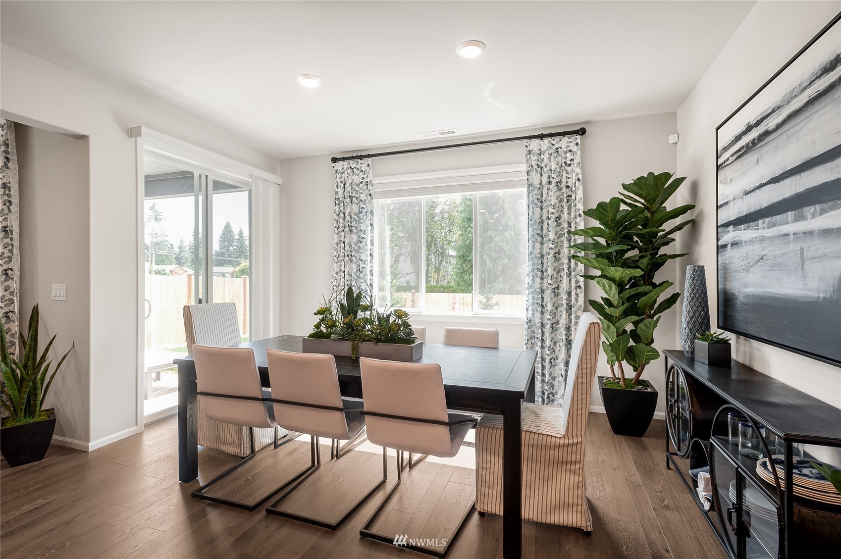 4106 235th Place Southeast, Unit 50 Bothell, WA 98021 - Photo 8 of 19 a living room with furniture potted plant and a window
