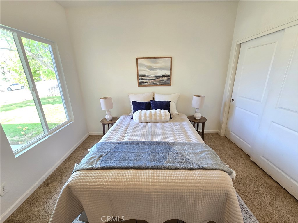 225 Sparrow Court Red Bluff, CA 96080 - Photo 14 of 29 a bed sitting in a bedroom next to a window