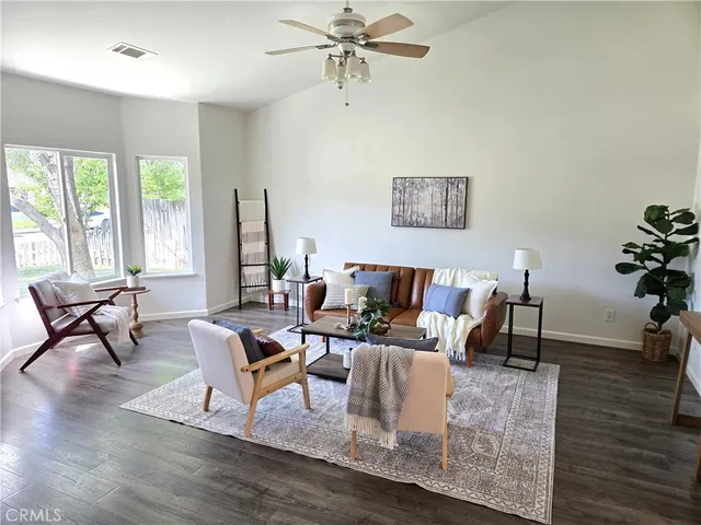 a living room with furniture and a window