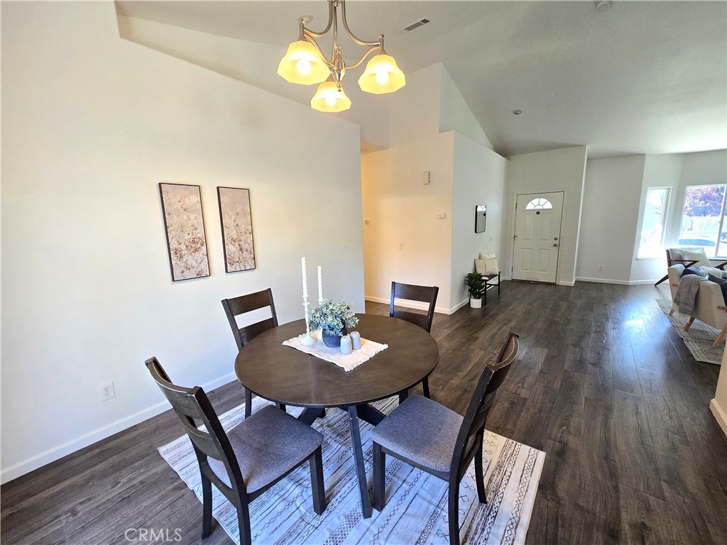 225 Sparrow Court Red Bluff, CA 96080 - Photo 8 of 29 a view of a dining room with furniture and wooden floor