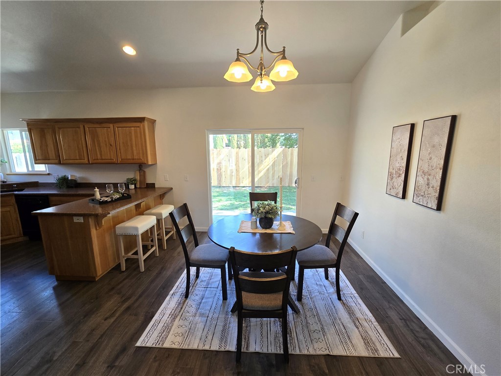 225 Sparrow Court Red Bluff, CA 96080 - Photo 9 of 29 a dining room with furniture and wooden floor