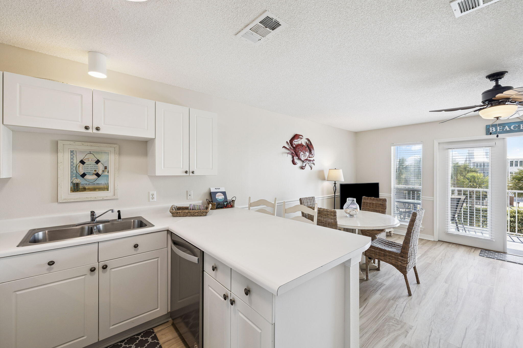 144 Spires Lane, Unit 310 Santa Rosa Beach, FL 32459 - Photo 15 of 41 a view of kitchen and sink with wooden floor