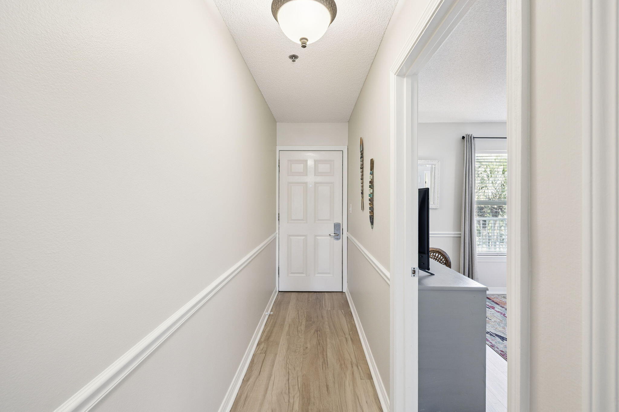144 Spires Lane, Unit 310 Santa Rosa Beach, FL 32459 - Photo 18 of 41 a view of a hallway with a white walls