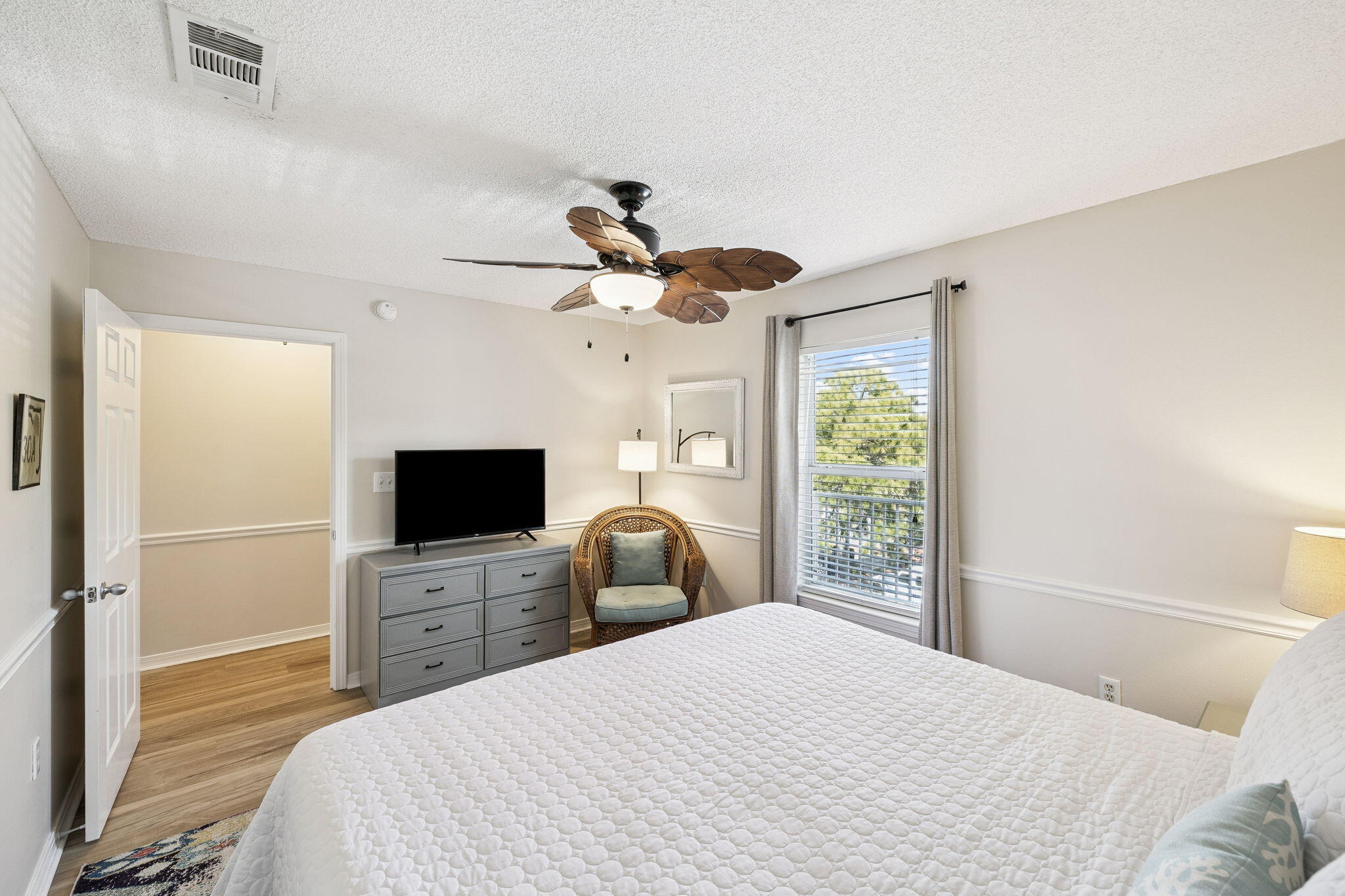 144 Spires Lane, Unit 310 Santa Rosa Beach, FL 32459 - Photo 20 of 41 a bedroom with a bed and a flat screen tv