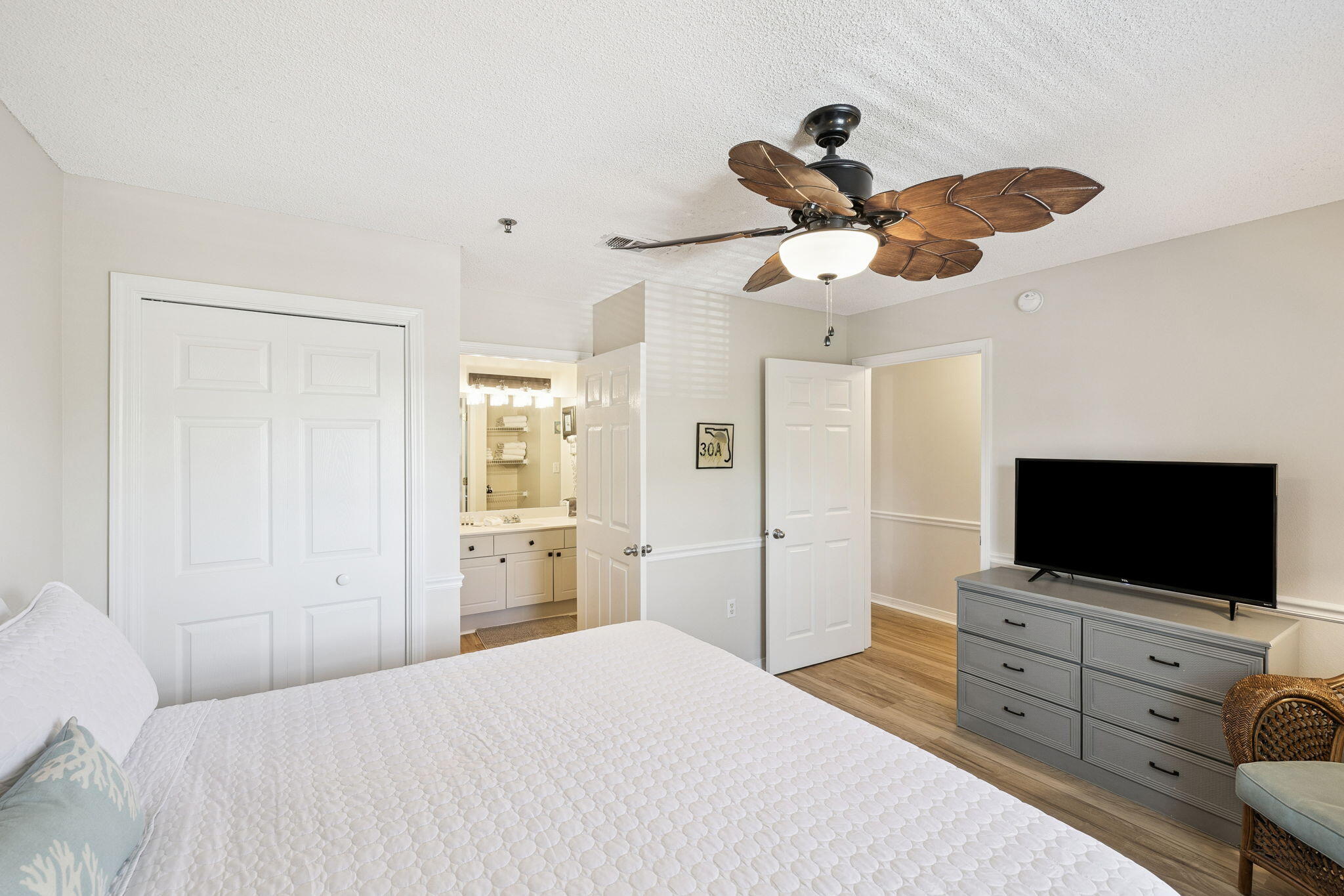 144 Spires Lane, Unit 310 Santa Rosa Beach, FL 32459 - Photo 21 of 41 a bedroom with a bed and a flat screen tv