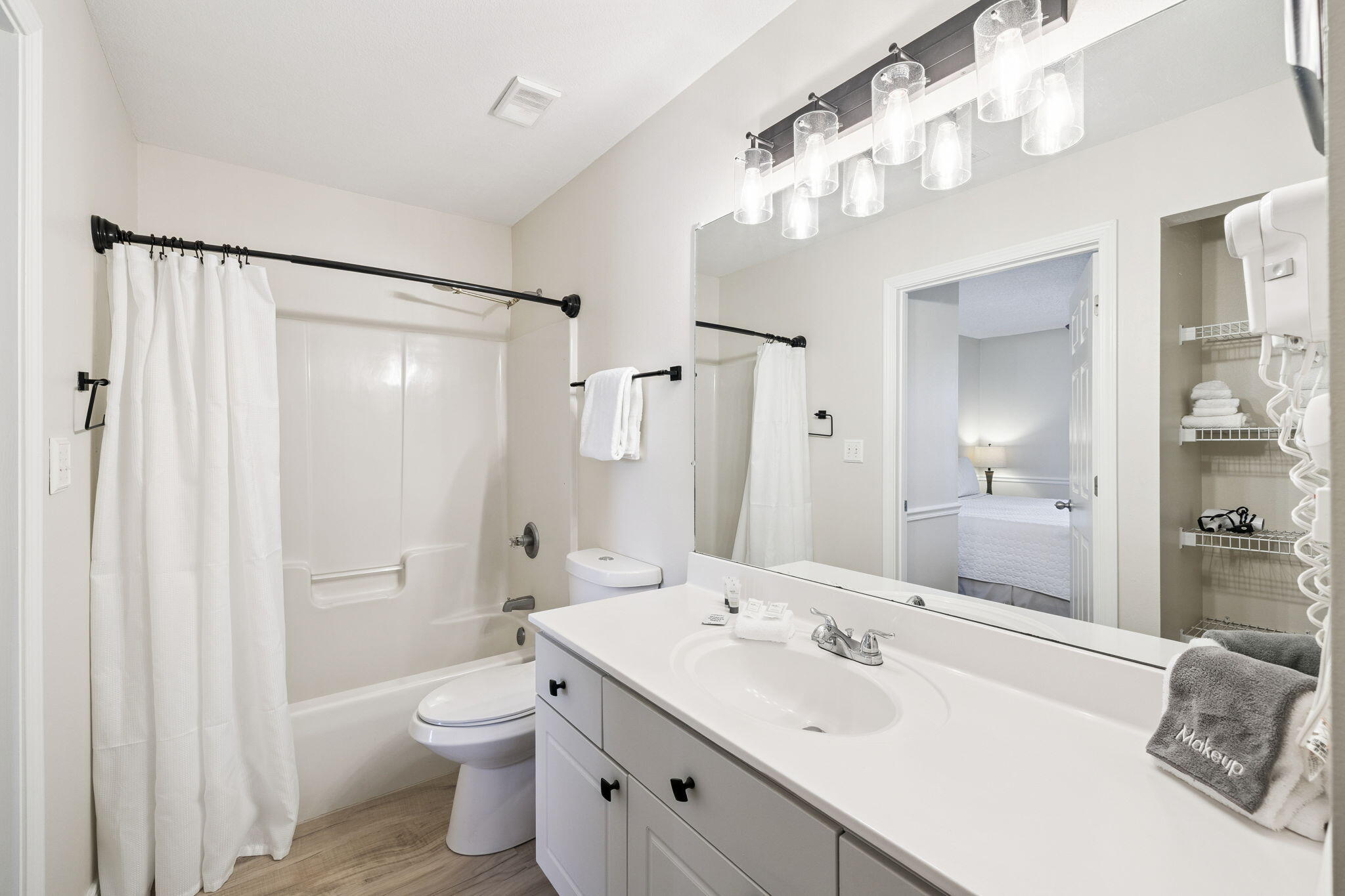 144 Spires Lane, Unit 310 Santa Rosa Beach, FL 32459 - Photo 25 of 41 a bathroom with a double vanity sink mirror and toilet