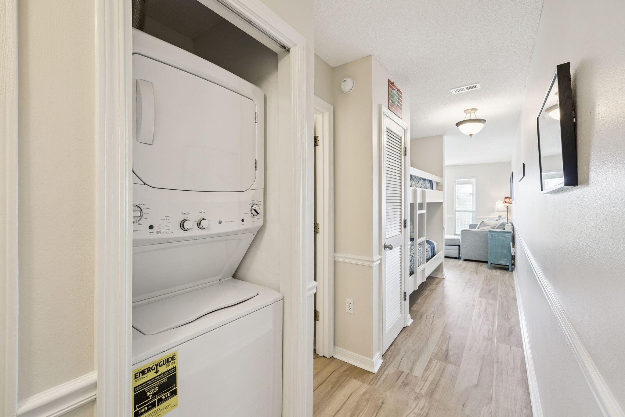 144 Spires Lane, Unit 310 Santa Rosa Beach, FL 32459 - Photo 26 of 41 a view of washer and dryer with wooden floor