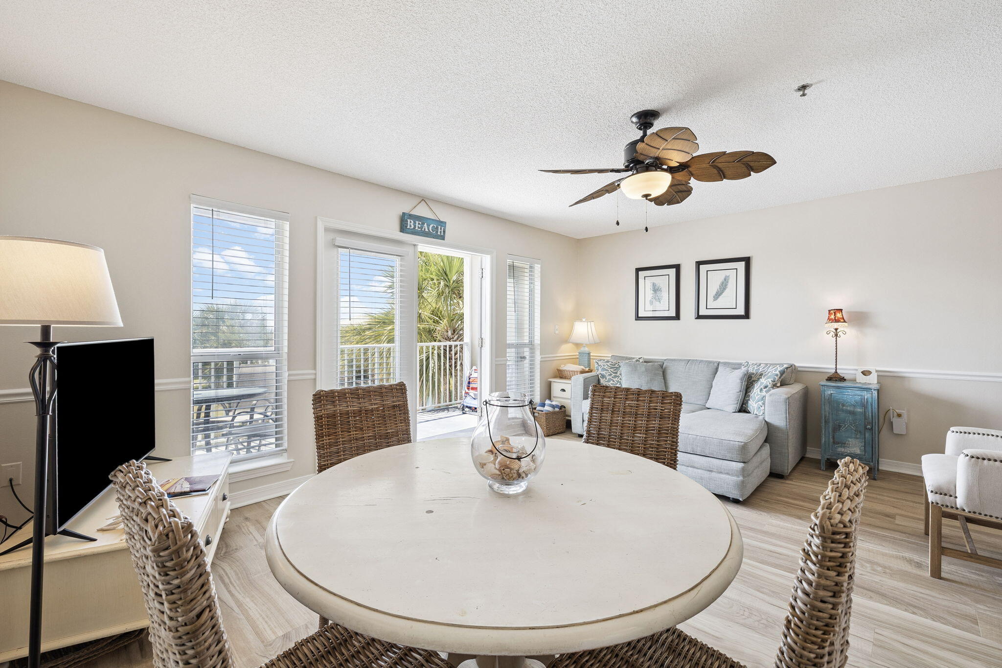 144 Spires Lane, Unit 310 Santa Rosa Beach, FL 32459 - Photo 9 of 41 a living room with furniture a flat screen tv and a large window