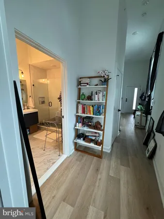 a view of a hallway with furniture and stairs