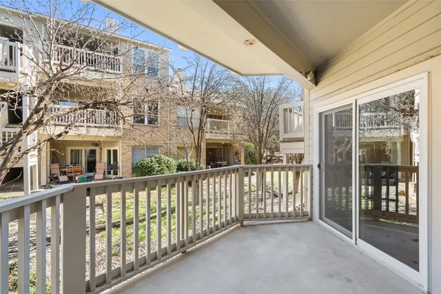 a view of a large building from a balcony