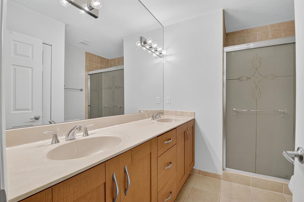 3237 Clint Moore Road, Unit 206 Boca Raton, FL 33496 - Photo 16 of 49 a bathroom with a sink and a mirror