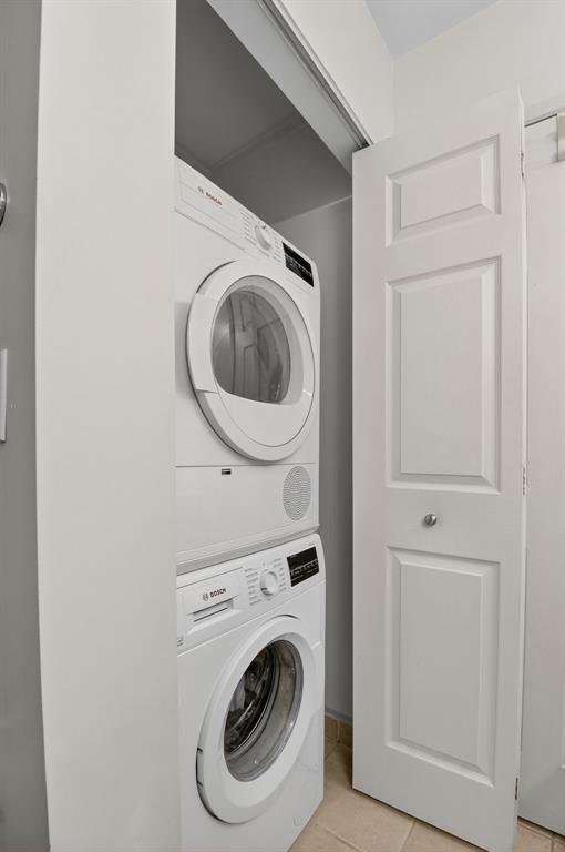 3237 Clint Moore Road, Unit 206 Boca Raton, FL 33496 - Photo 17 of 49 a utility room with dryer and washer