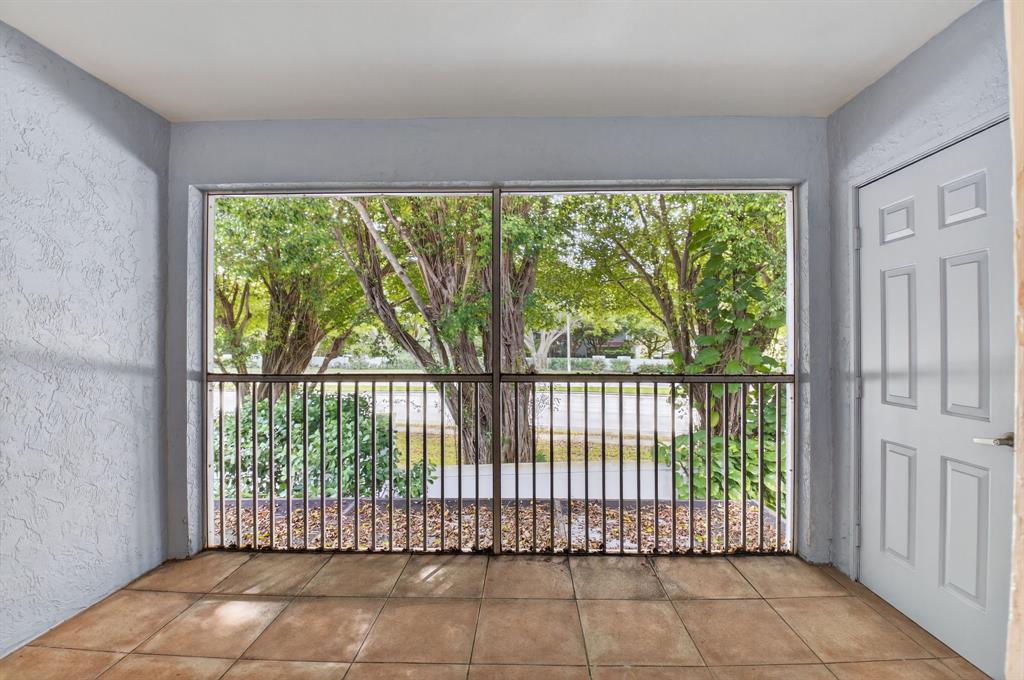 3237 Clint Moore Road, Unit 206 Boca Raton, FL 33496 - Photo 21 of 49 a view of a large window with an outdoor space