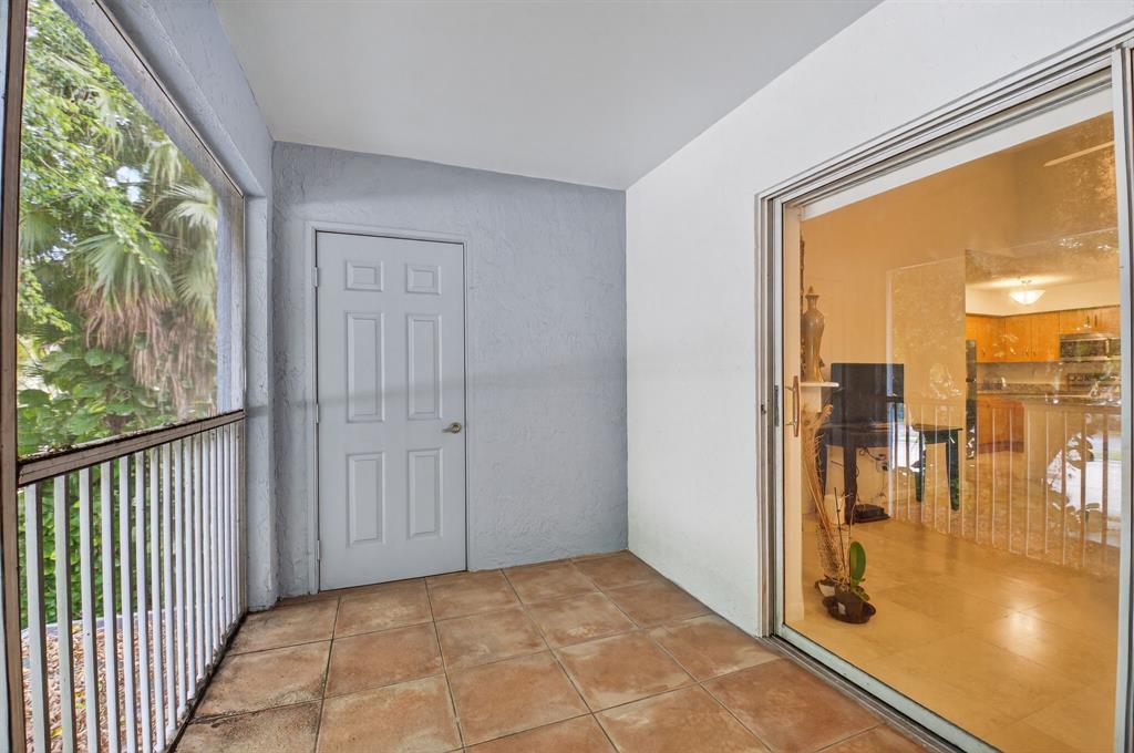 3237 Clint Moore Road, Unit 206 Boca Raton, FL 33496 - Photo 23 of 49 a view of a hallway with city view