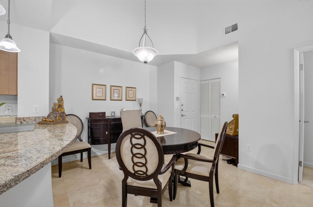 3237 Clint Moore Road, Unit 206 Boca Raton, FL 33496 - Photo 3 of 49 a dining room with furniture and window