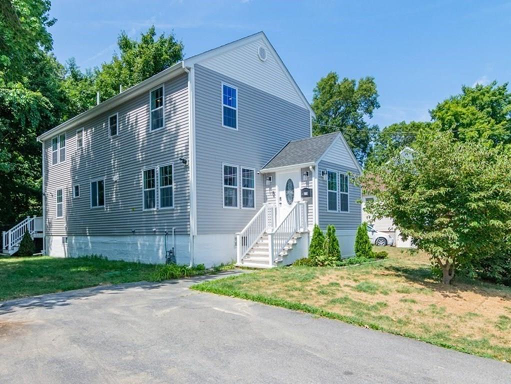 23 Amelian Road Randolph, MA 02368 - Photo 1 of 39 a front view of a house with garden