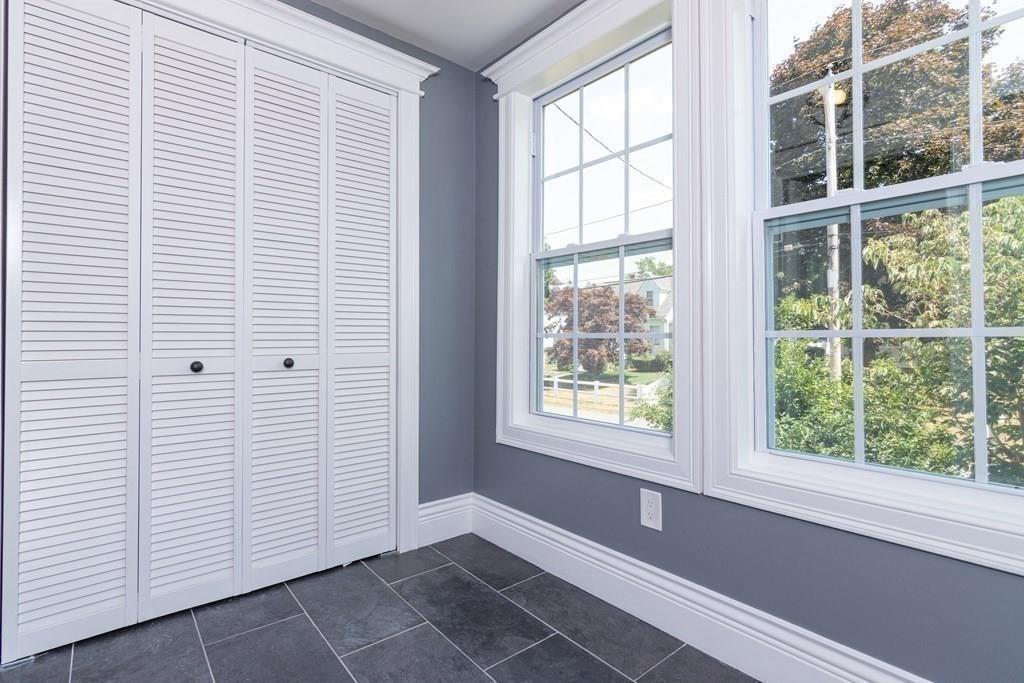 23 Amelian Road Randolph, MA 02368 - Photo 12 of 39 a view of empty room with windows