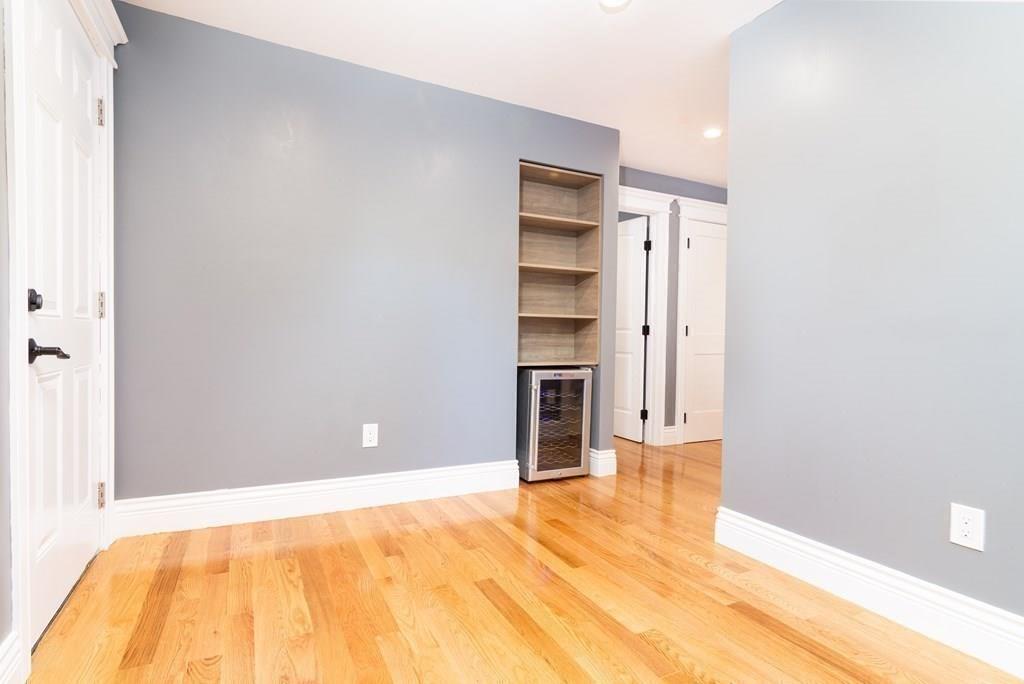 23 Amelian Road Randolph, MA 02368 - Photo 13 of 39 a view of a livingroom with wooden floor