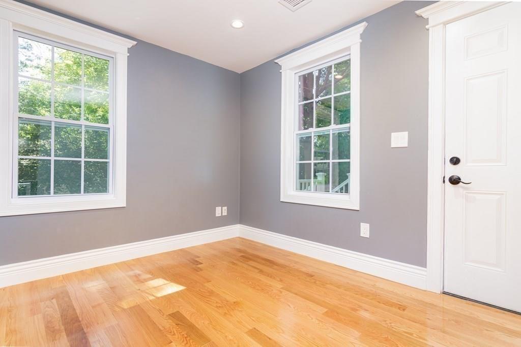 23 Amelian Road Randolph, MA 02368 - Photo 14 of 39 a view of an empty room with a window