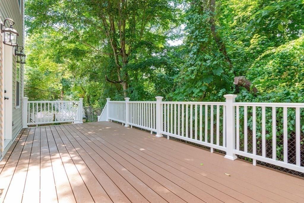 23 Amelian Road Randolph, MA 02368 - Photo 33 of 39 a view of backyard with a wooden deck