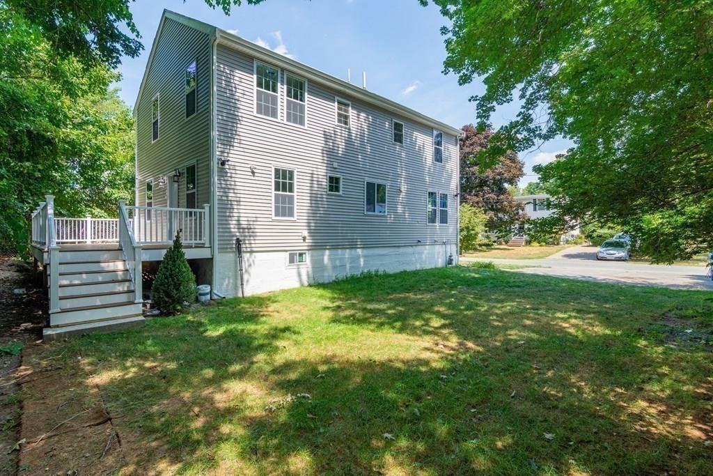 23 Amelian Road Randolph, MA 02368 - Photo 35 of 39 a view of a house with a yard