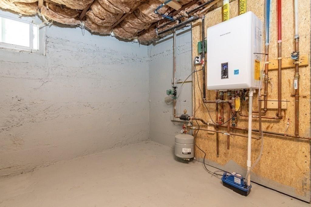 23 Amelian Road Randolph, MA 02368 - Photo 38 of 39 a view of a room with rack on the wall