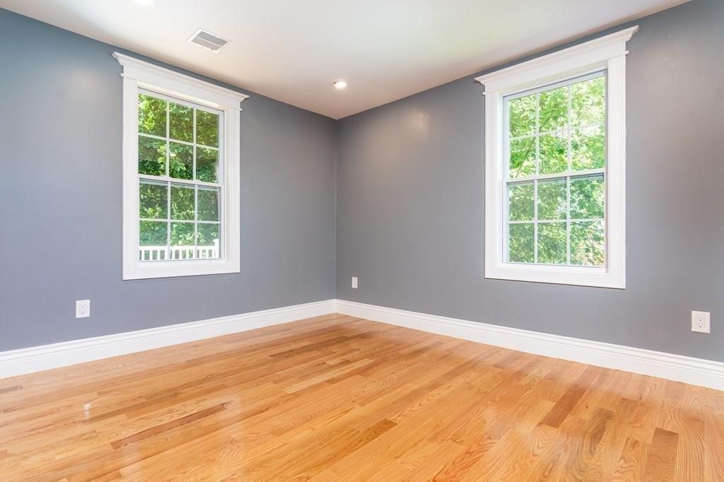 23 Amelian Road Randolph, MA 02368 - Photo 10 of 39 a view of an empty room with a window