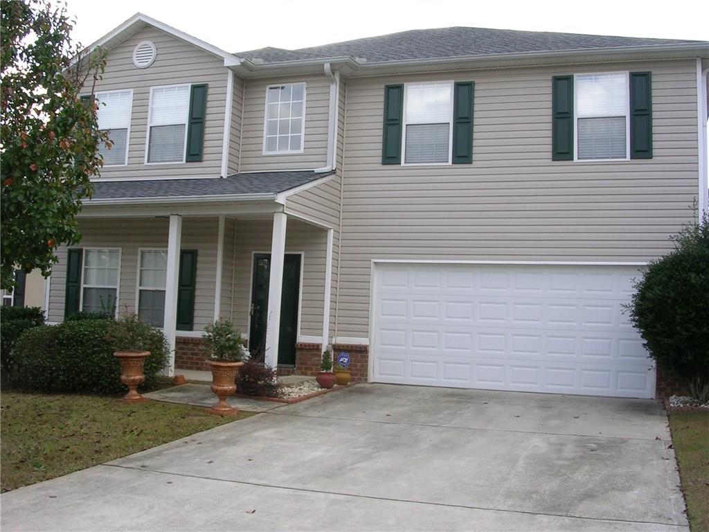 1606 Thornwick Trace Stockbridge, GA 30281 - Photo 1 of 1 a view of a house with brick walls and a yard