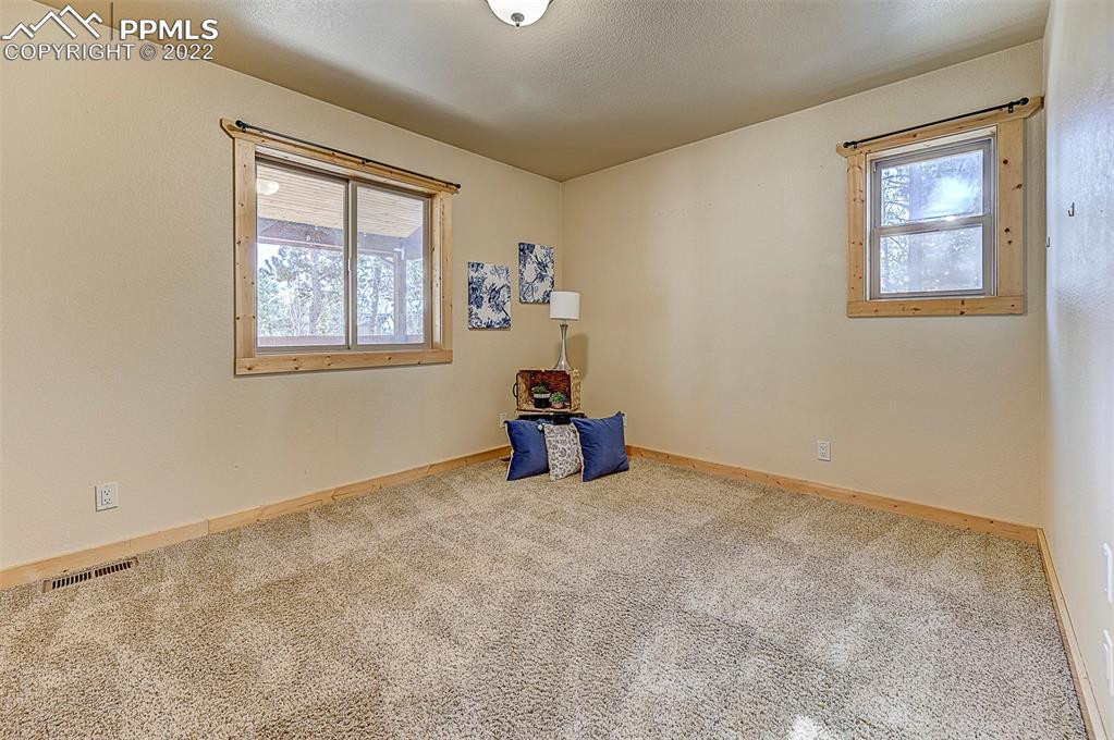 897 Fossil Creek Road Florissant, CO 80816 - Photo 12 of 40 an empty room with windows