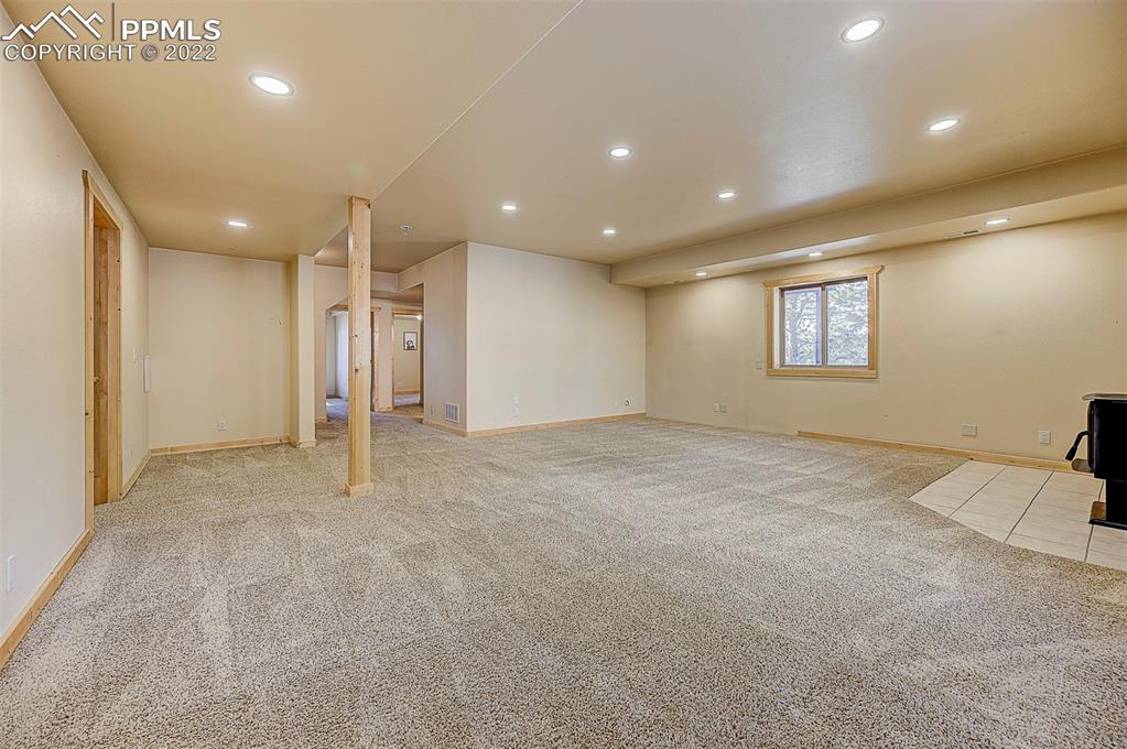 897 Fossil Creek Road Florissant, CO 80816 - Photo 21 of 40 a view of an empty room with a window