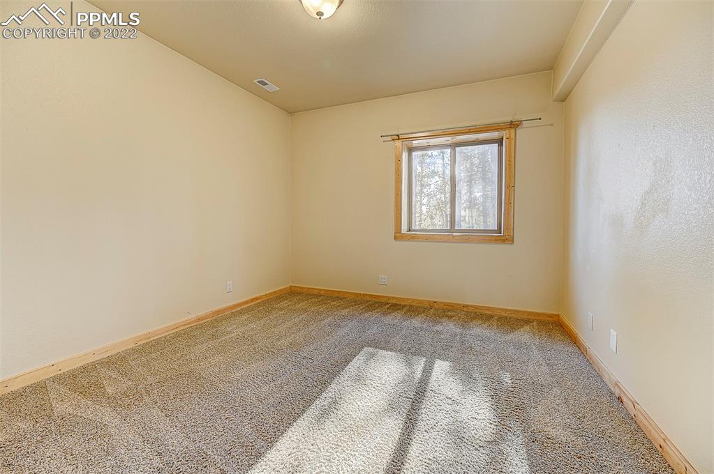 897 Fossil Creek Road Florissant, CO 80816 - Photo 22 of 40 an empty room with a window
