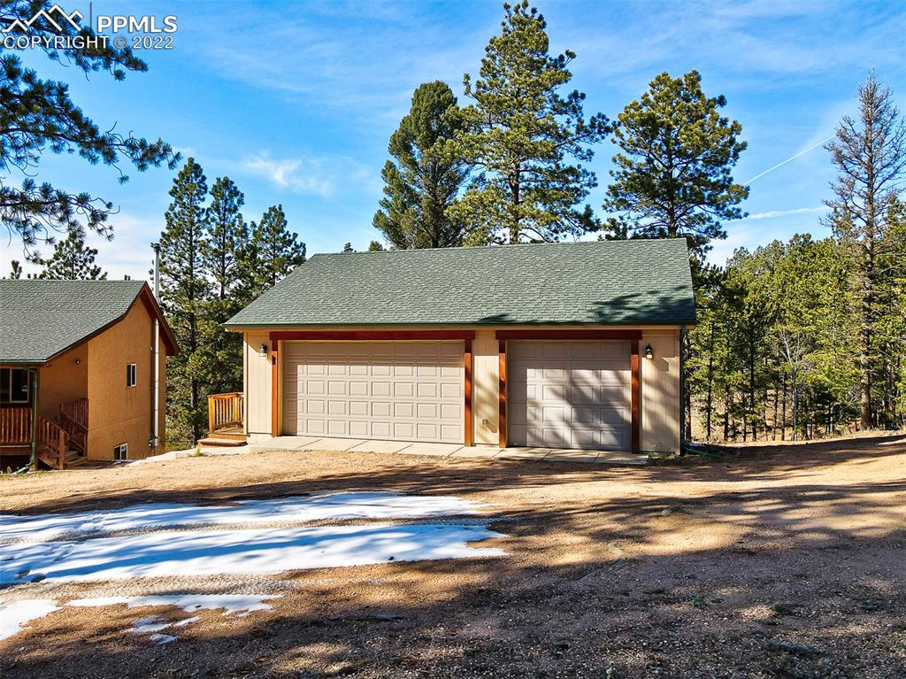 897 Fossil Creek Road Florissant, CO 80816 - Photo 26 of 40 a front view of a house with a yard