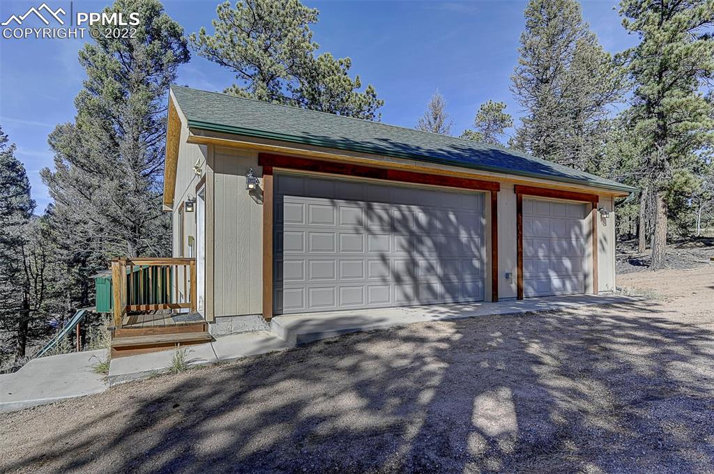 897 Fossil Creek Road Florissant, CO 80816 - Photo 27 of 40 a front view of a house with a tree