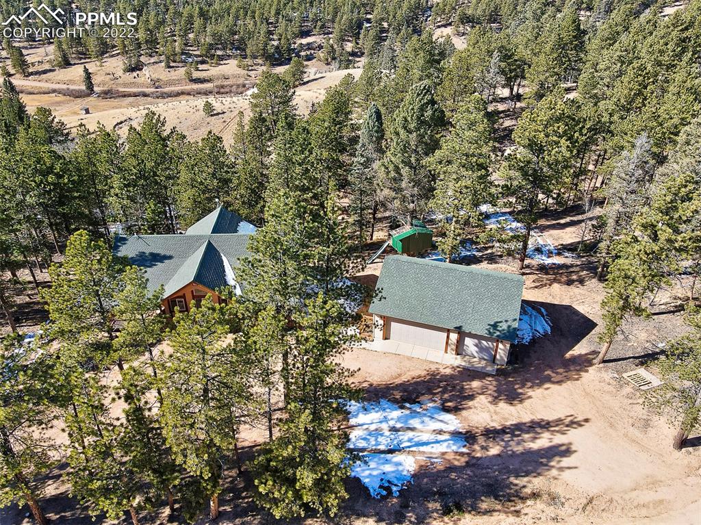 897 Fossil Creek Road Florissant, CO 80816 - Photo 34 of 40 an aerial view of a house with yard and outdoor seating