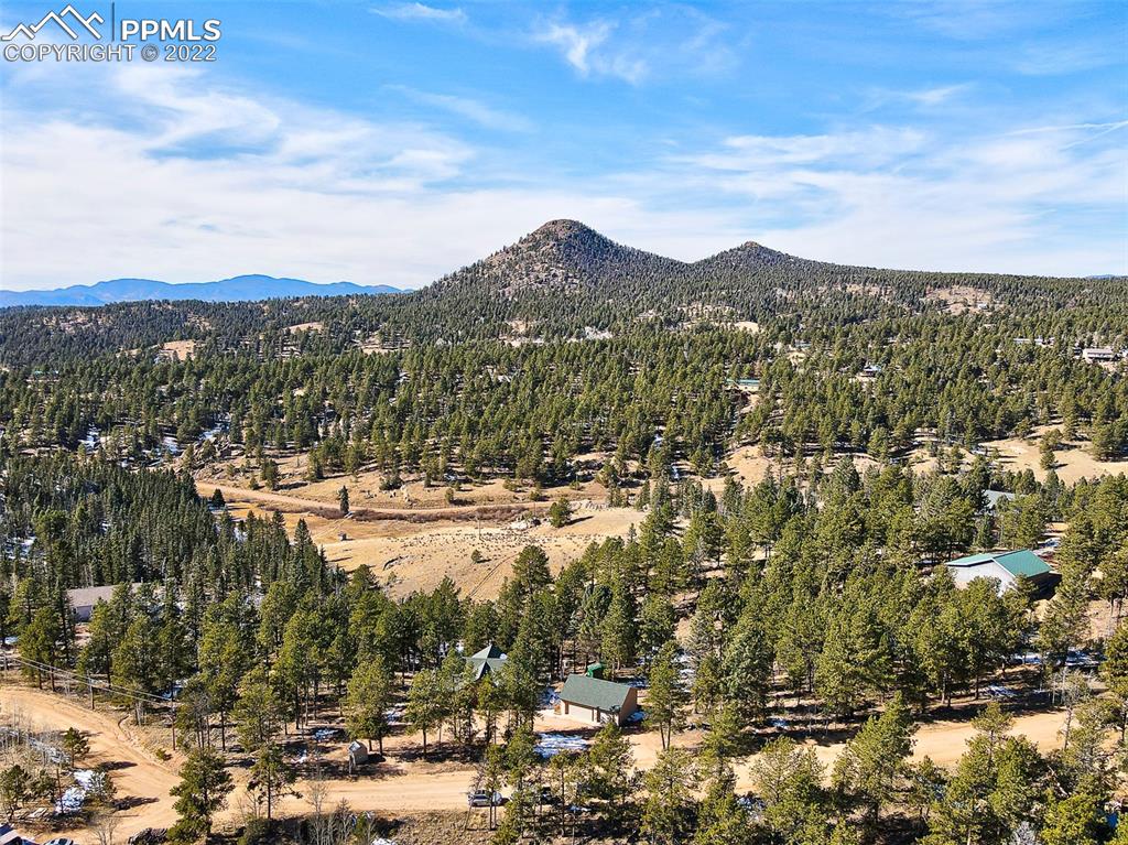 897 Fossil Creek Road Florissant, CO 80816 - Photo 38 of 40 a view of a city with mountains in the background