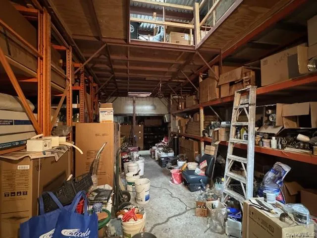 a room with water heater and wooden walls