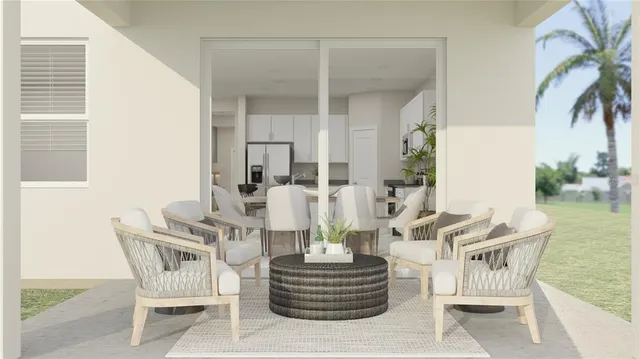 a living room with fireplace furniture and a potted plant