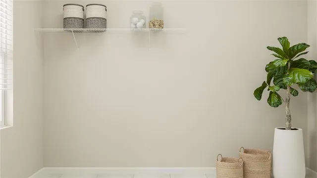 a living room with furniture and a lamp