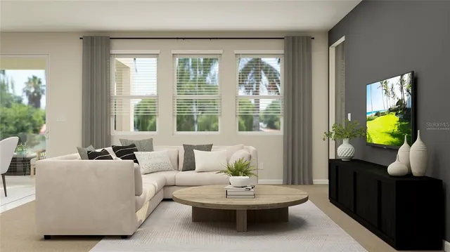 a living room with furniture and a window