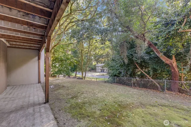 a view of a house with a tree