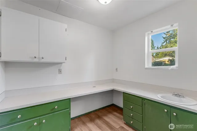 a room with cabinets and window