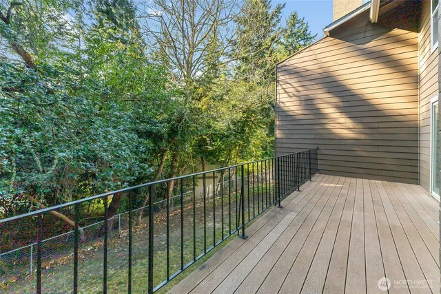 a view of balcony with wooden floor