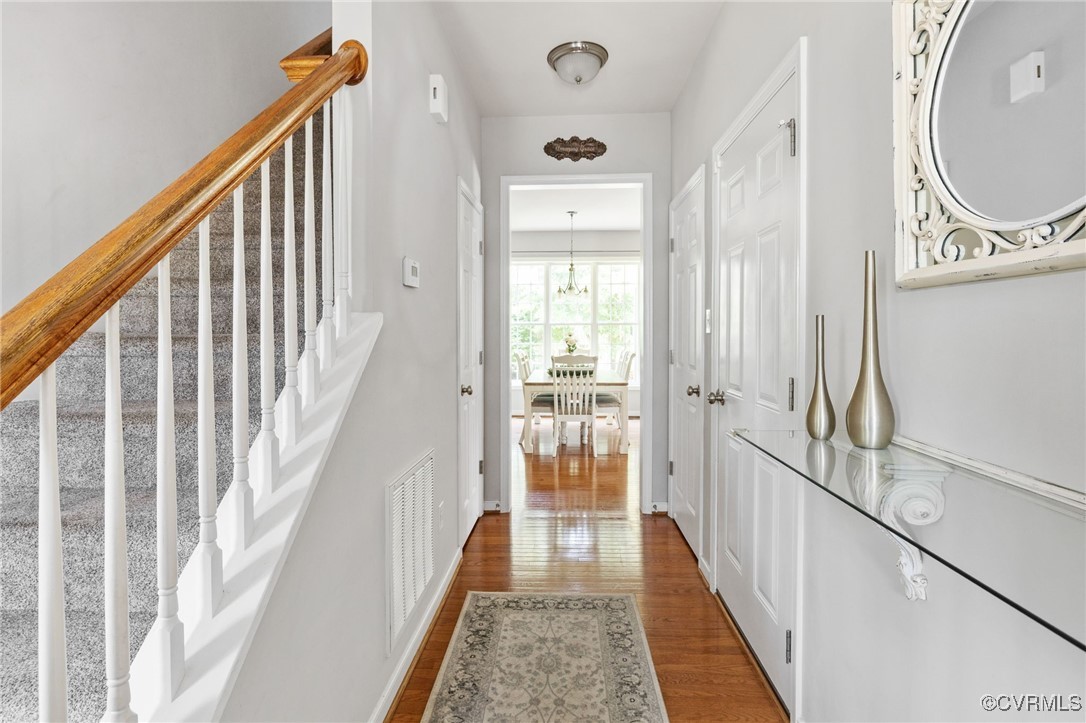 14300 Wallingham Loop Midlothian, VA 23114 - Photo 12 of 50 a view of a hallway with wooden floor and windows