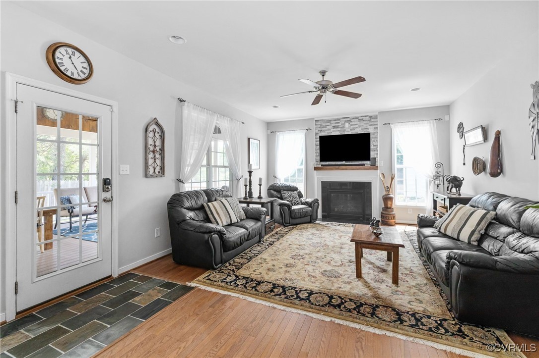 14300 Wallingham Loop Midlothian, VA 23114 - Photo 24 of 50 a living room with furniture a fireplace and a flat screen tv
