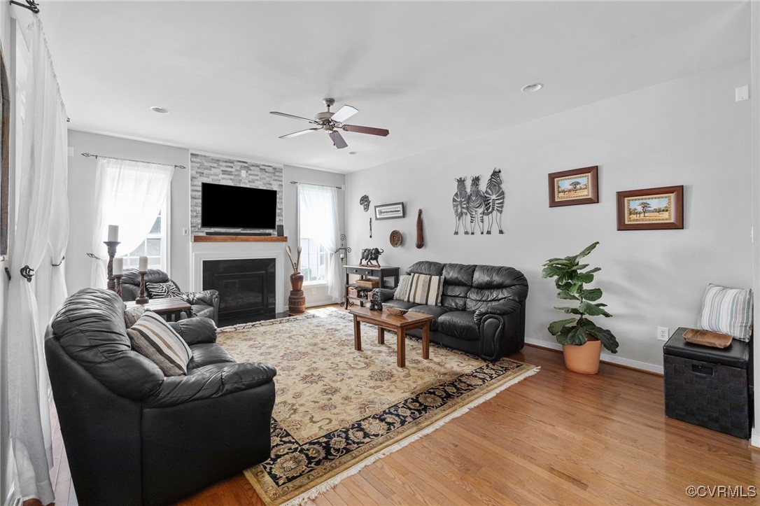 14300 Wallingham Loop Midlothian, VA 23114 - Photo 25 of 50 a living room with furniture a fireplace and a flat screen tv