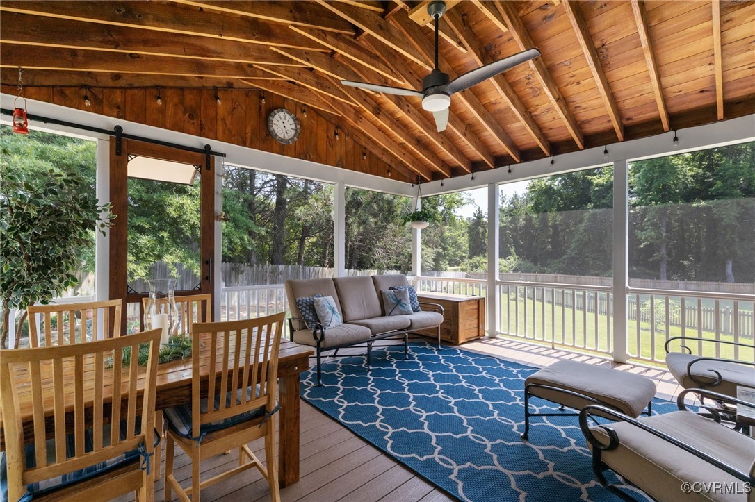 14300 Wallingham Loop Midlothian, VA 23114 - Photo 29 of 50 a view of a patio with a dining table and chairs with wooden floor