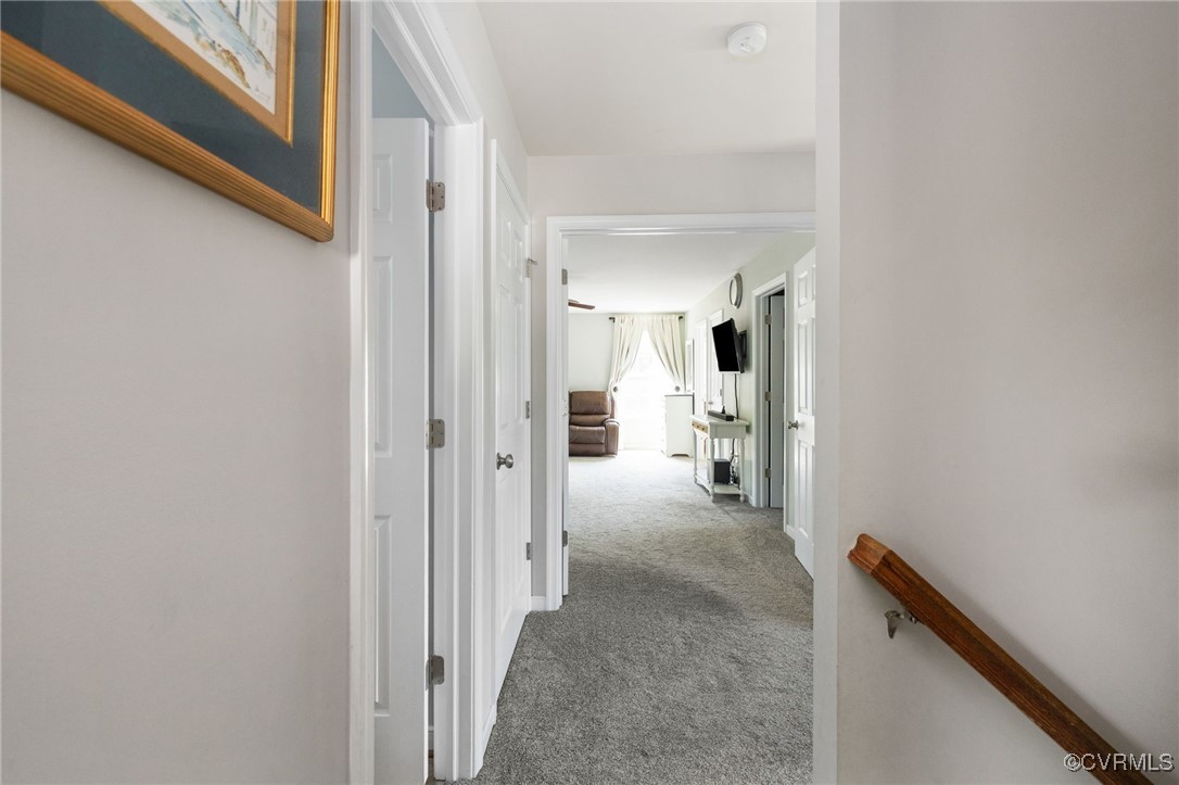 14300 Wallingham Loop Midlothian, VA 23114 - Photo 31 of 50 a view of a hallway with wooden floor and a bathroom