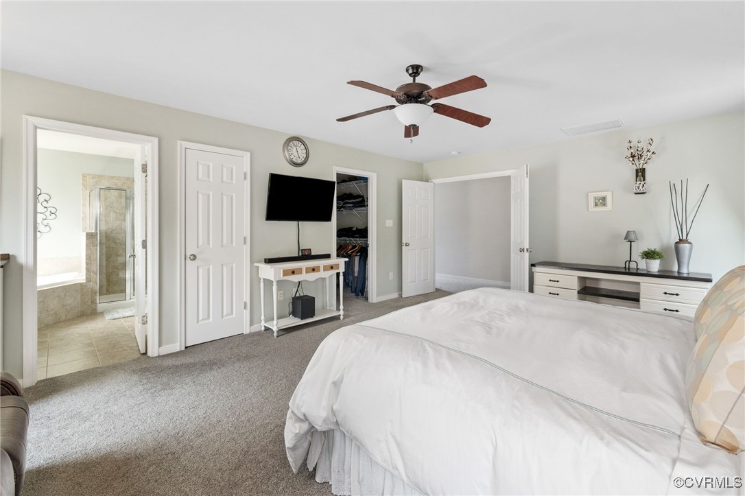 14300 Wallingham Loop Midlothian, VA 23114 - Photo 36 of 50 a bedroom with a bed and a flat screen tv