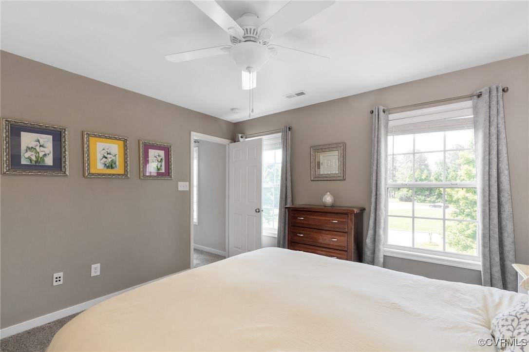 14300 Wallingham Loop Midlothian, VA 23114 - Photo 49 of 50 a bedroom with a bed and wooden floor