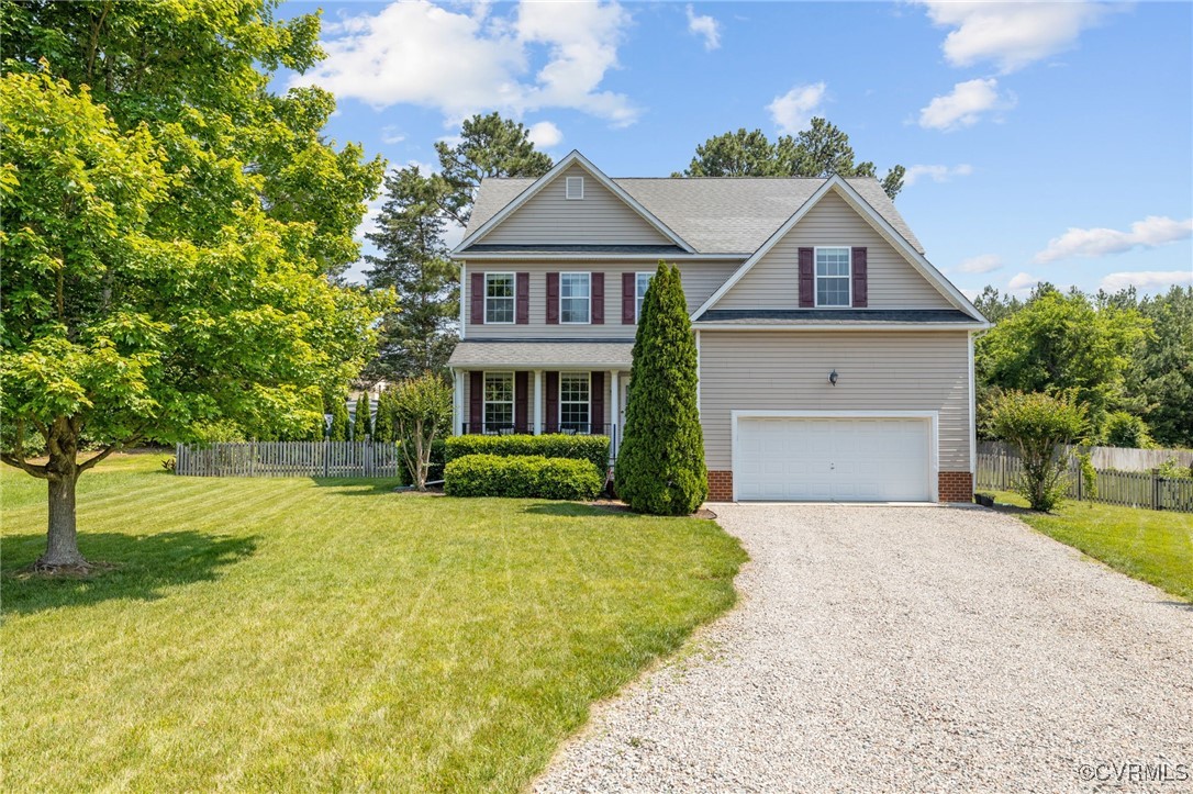 14300 Wallingham Loop Midlothian, VA 23114 - Photo 5 of 50 a front view of a house with a yard and garage